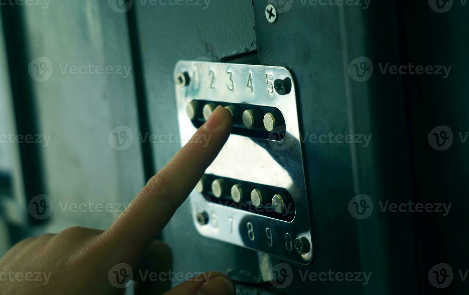 Applying security code on the door photo