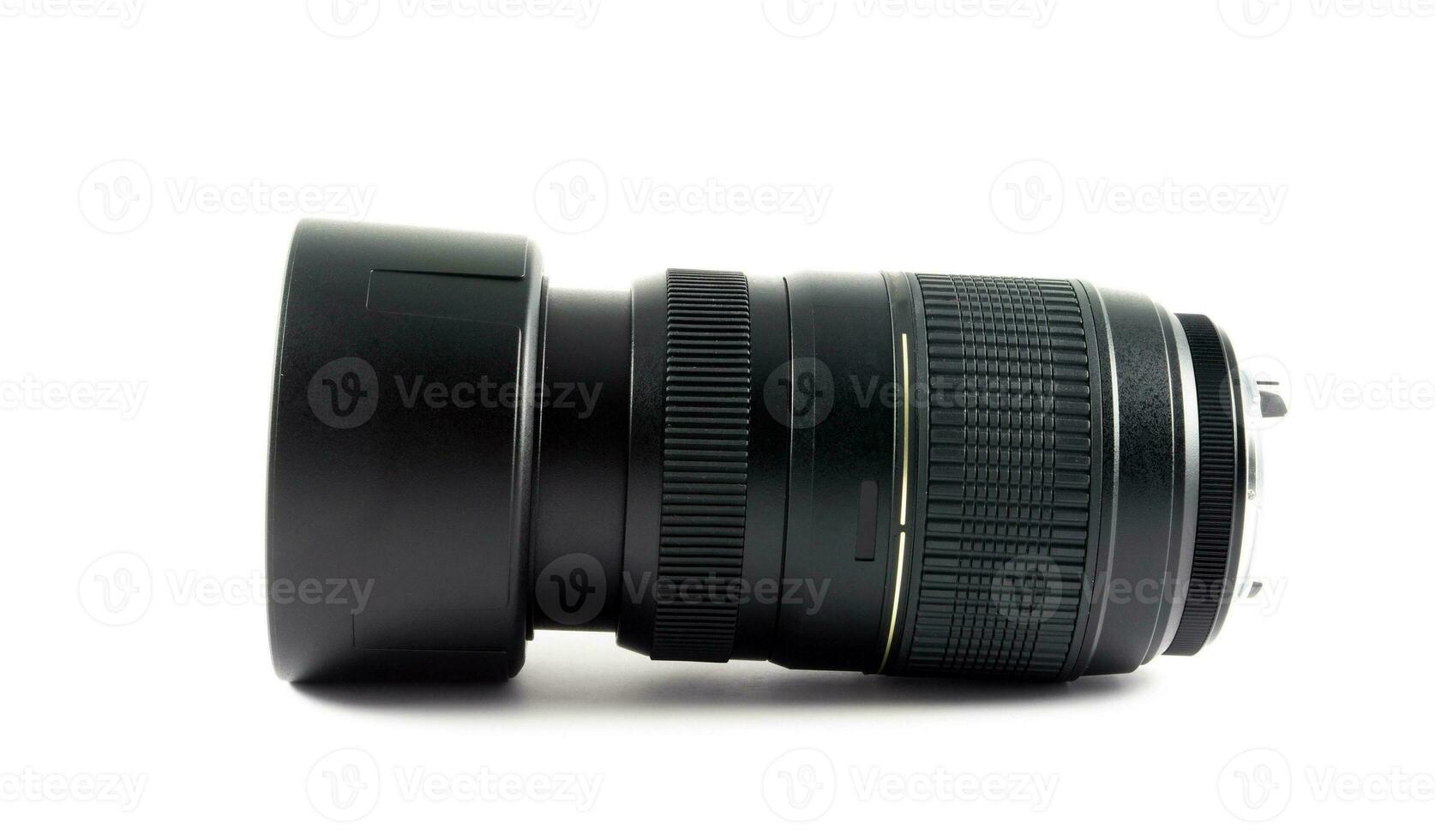 Black camera lens on white photo