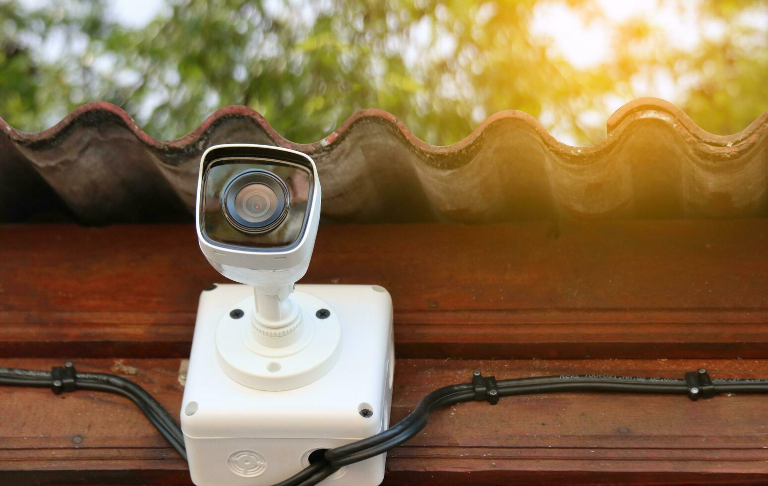 Dirty surveillance camera installed at a house photo