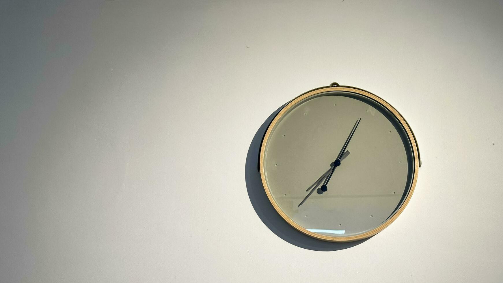 Clean modern clock hanging on the wall photo