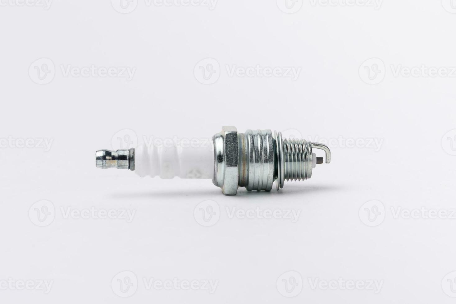 Car spark plugs on white background. Car spare parts. photo