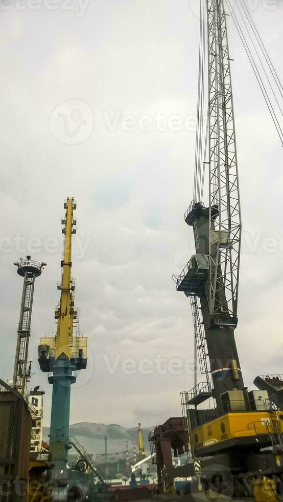 Port cranes against the sky. Cargo industrial port photo