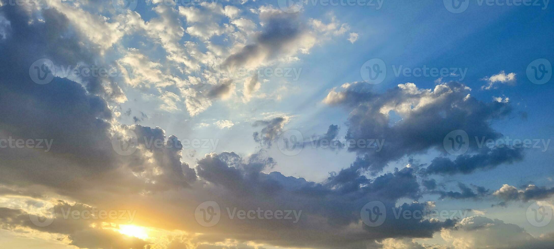 Clear and serene sky, soft clouds painting a celestial picture. The tranquil beauty of the atmosphere to enhance your projects. Purchase this celestial image to inspire and captivate. photo