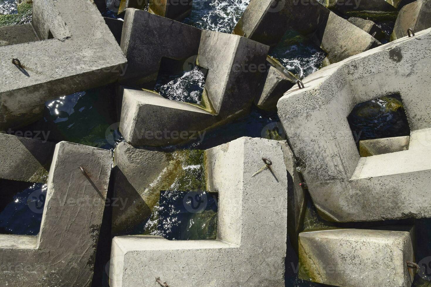 Breakwater of the rectangular stone figures. photo