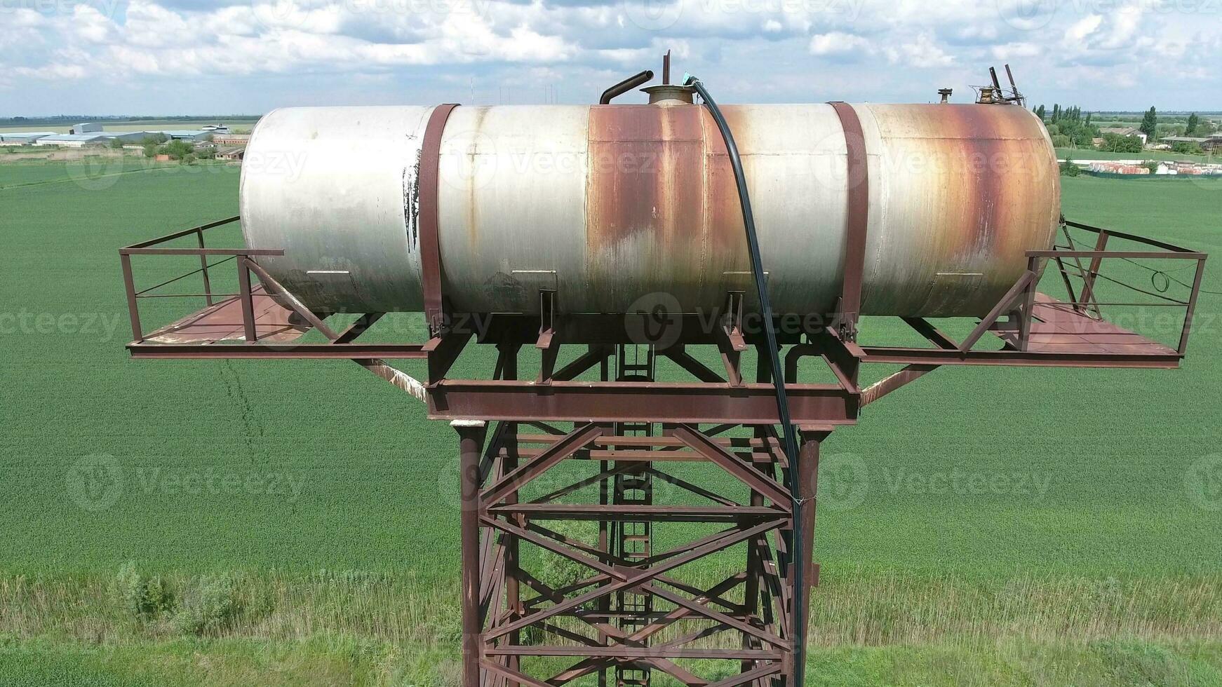 The water tower. An old rustic communal communication. The water tower photo