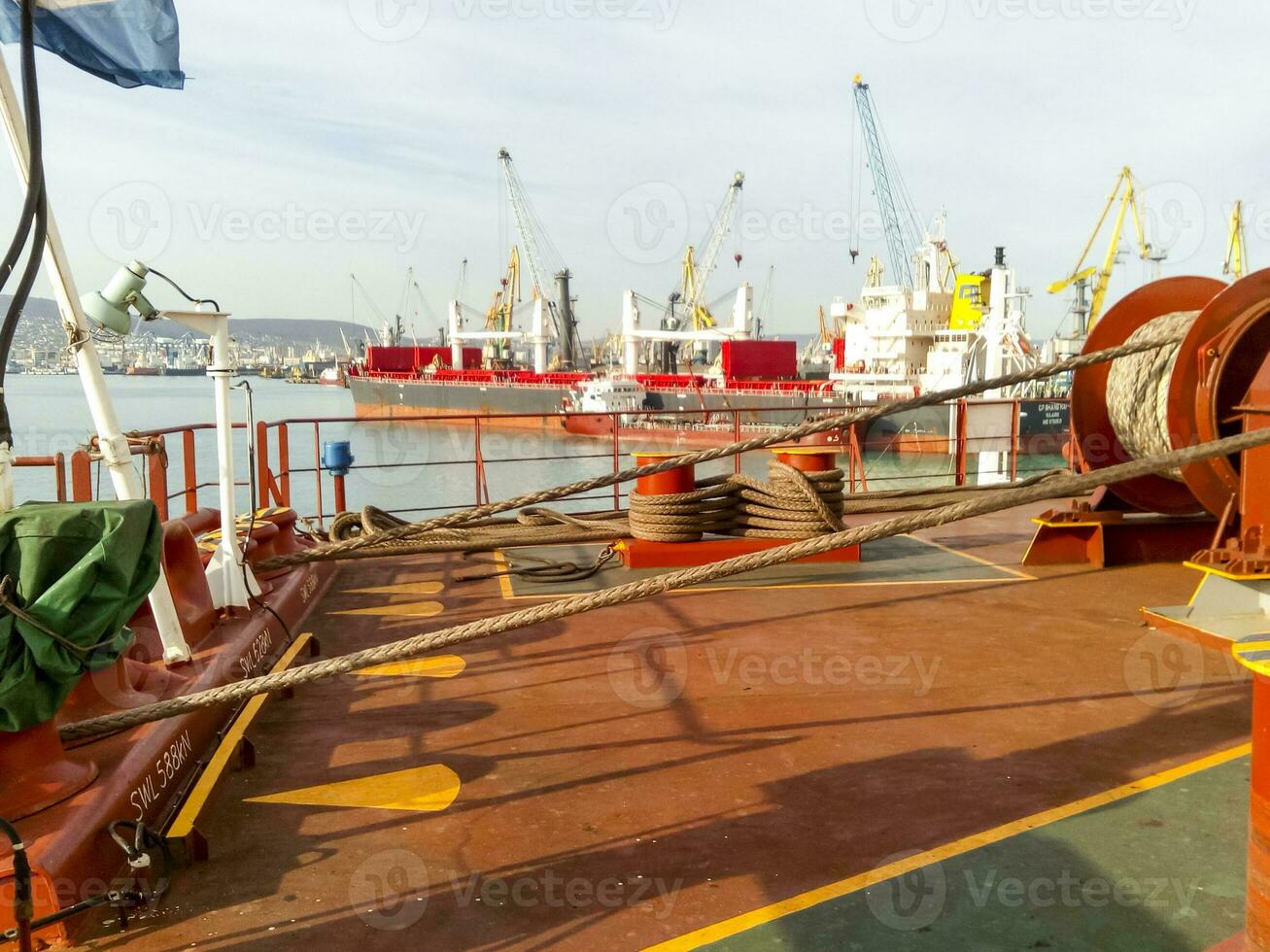 Mechanisms of tension control ropes. Winches. Equipment on the deck of a cargo ship or port photo