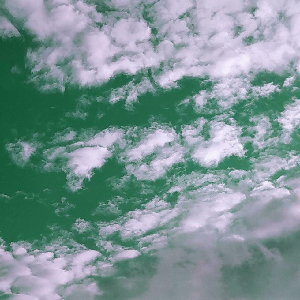 Green sky with beautiful white clouds. photo