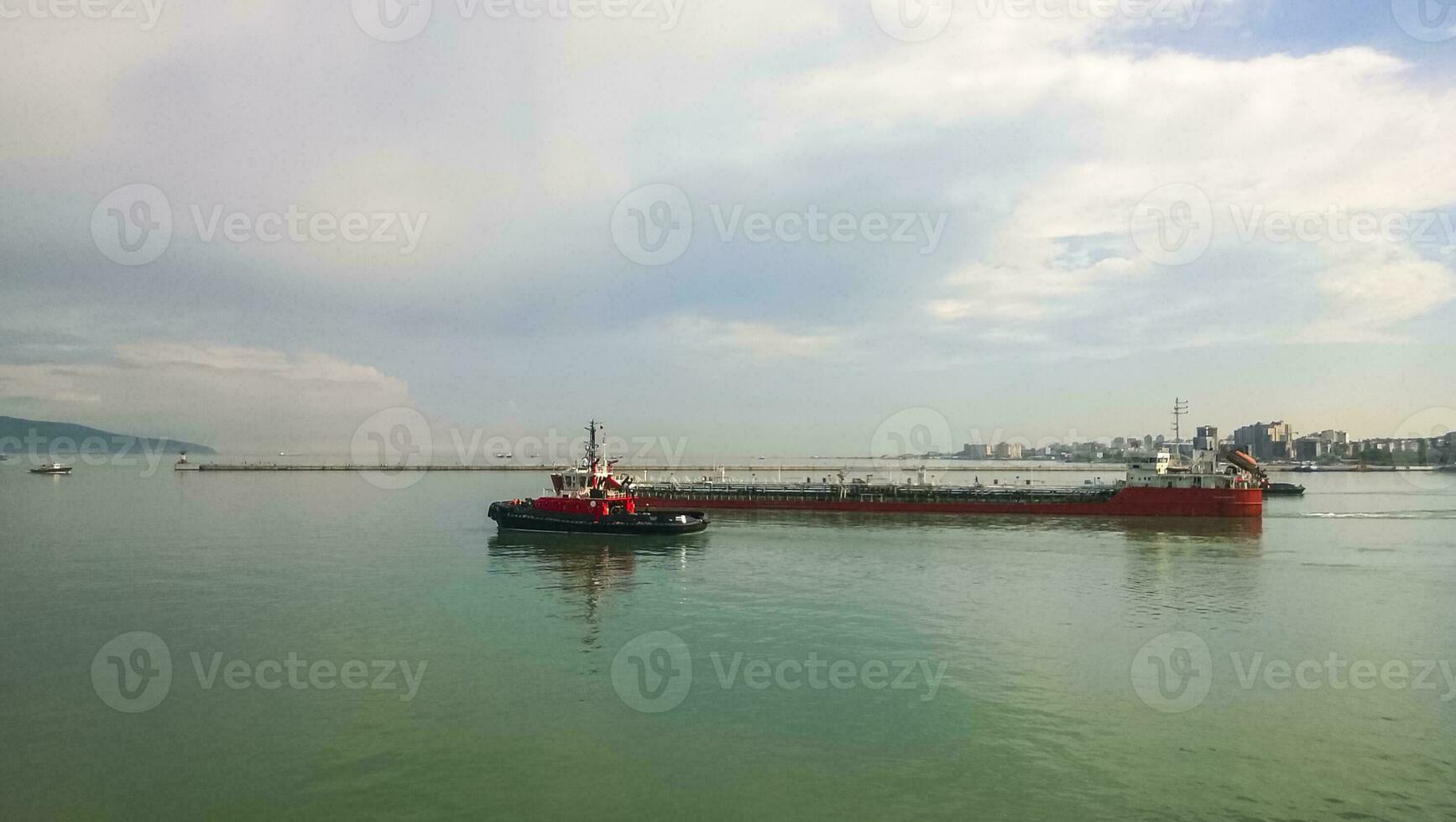 A service small boat in the harbor harbor. Tsemesskaya bay. Industrial port photo