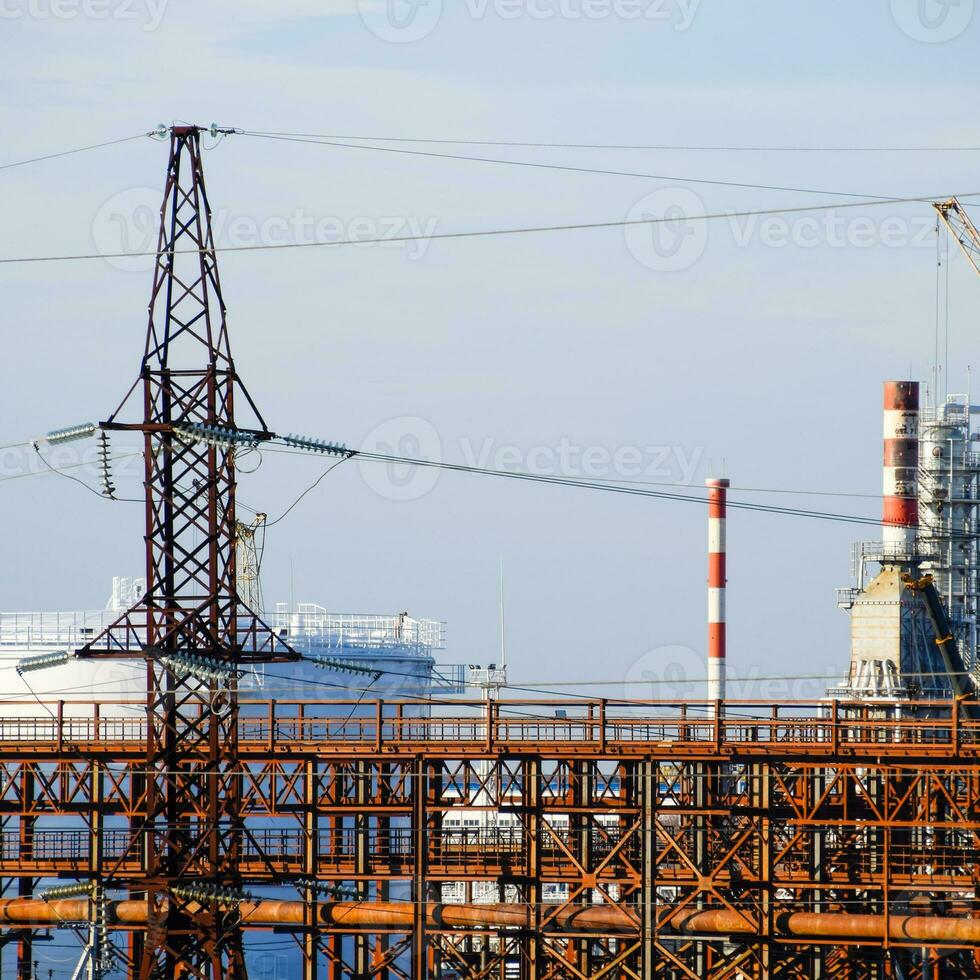 Distillation columns, pipes and other equipment furnaces refinery. photo