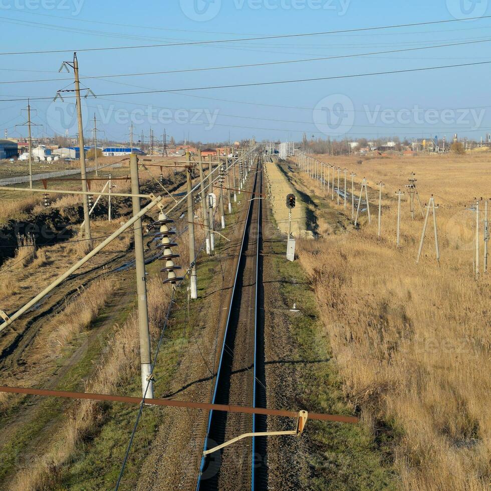Plot railway. Top view on the rails. High-voltage power lines for electric trains photo