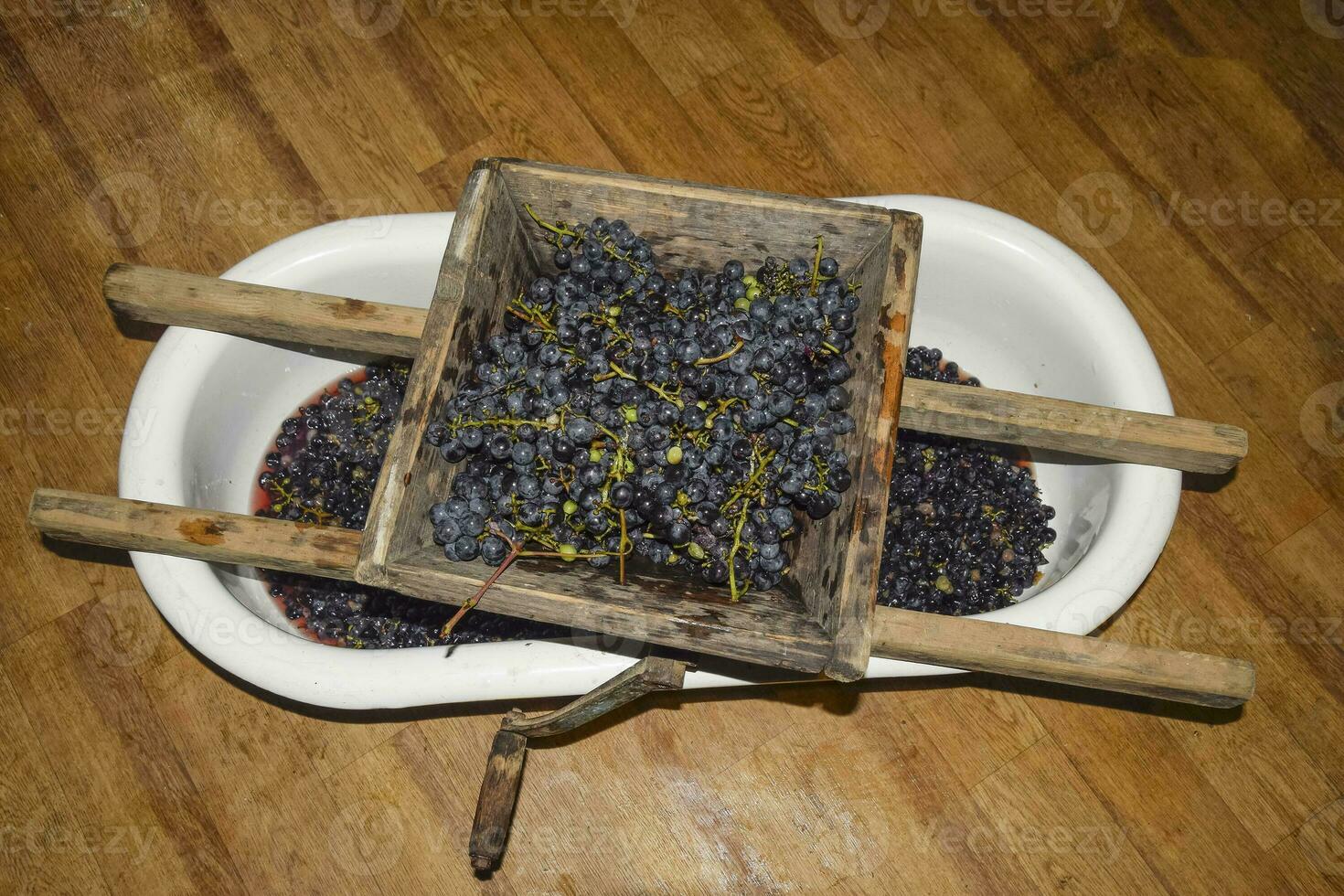 Manual mechanism for crushing grapes. Crush the grapes into juic photo
