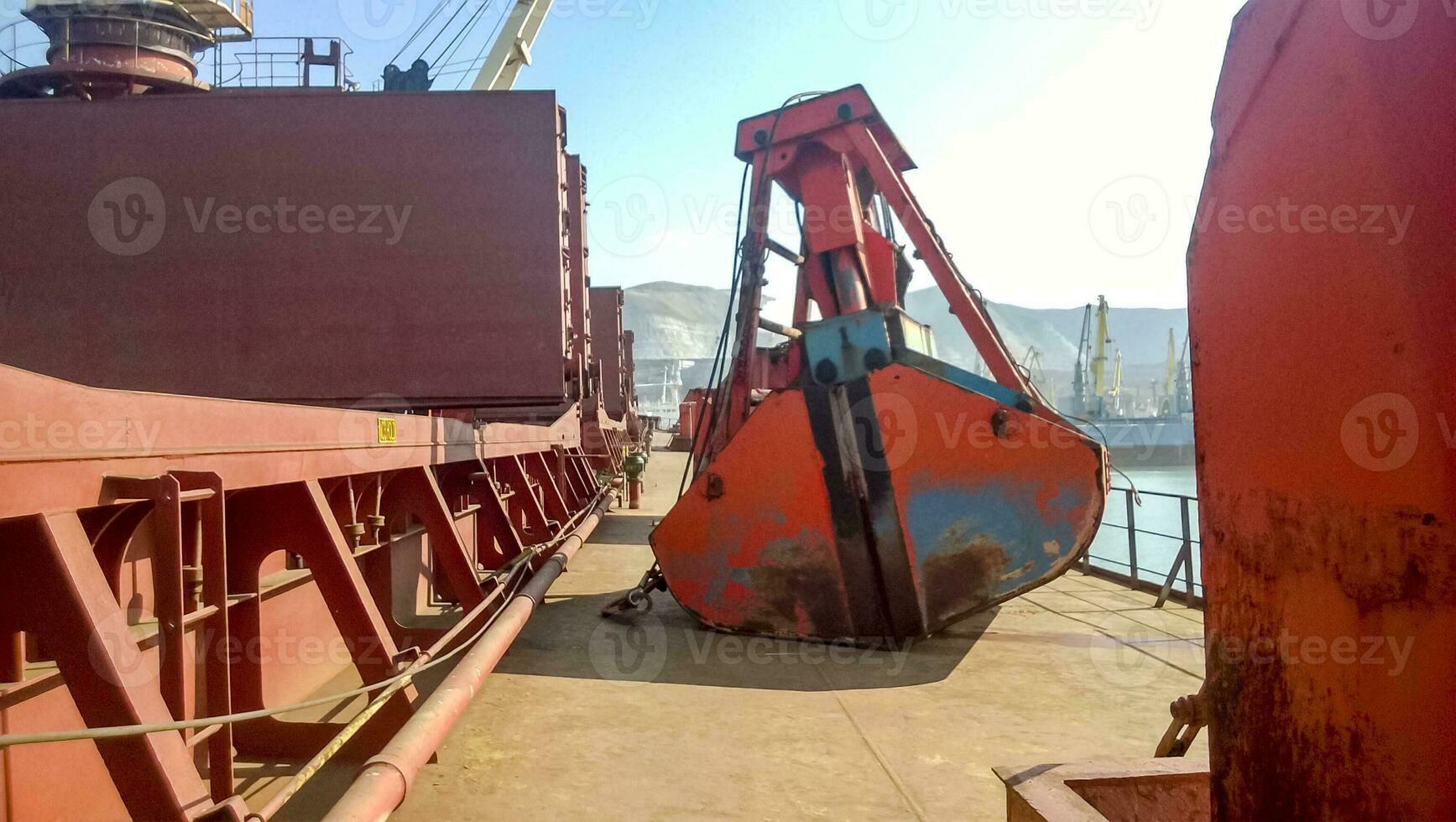 The deck of the vessel on which the ladle of the loading crane lies. Industrial port loading equipment photo