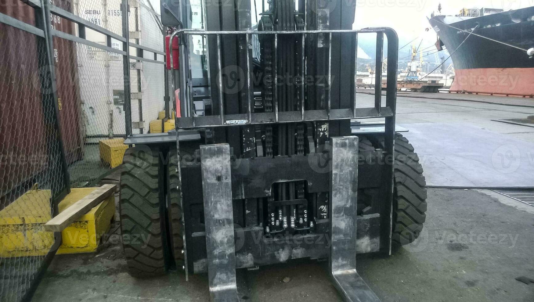 Forklift truck in the industrial cargo port. Service vehicles photo