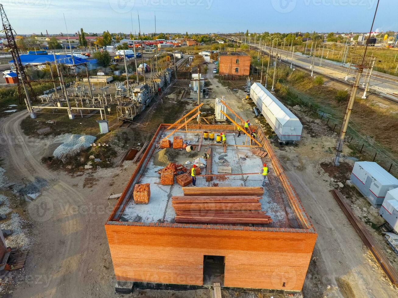 Construction of a brick building. Installation of the roof. Construction works. photo