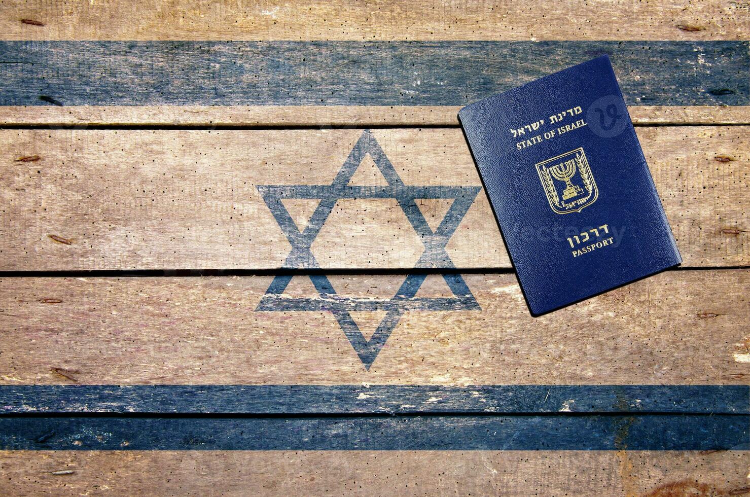 Israel passport on the table and flag photo