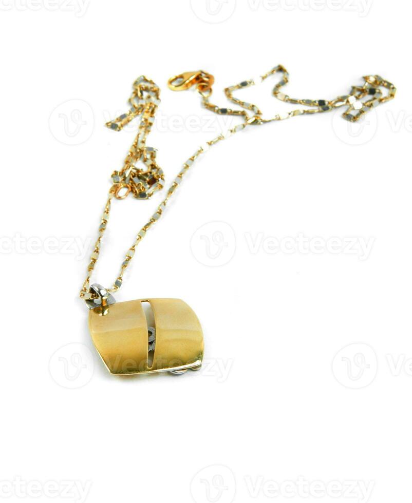 golden necklace on white photo