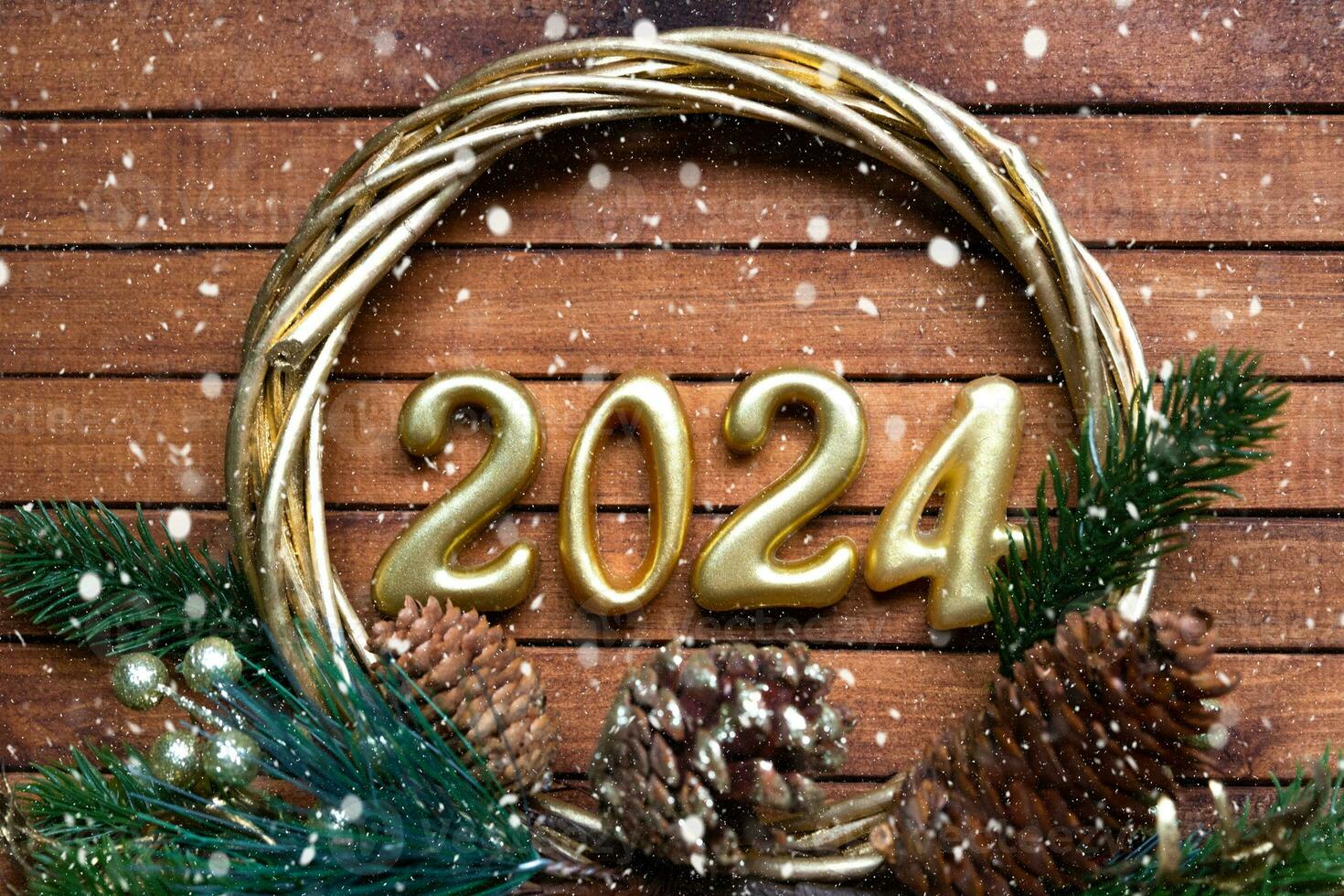 Happy New Year wooden numbers 2024 on cozy festive brown wooden background with sequins, snow, lights of garlands. Greetings, postcard. Calendar, cover photo