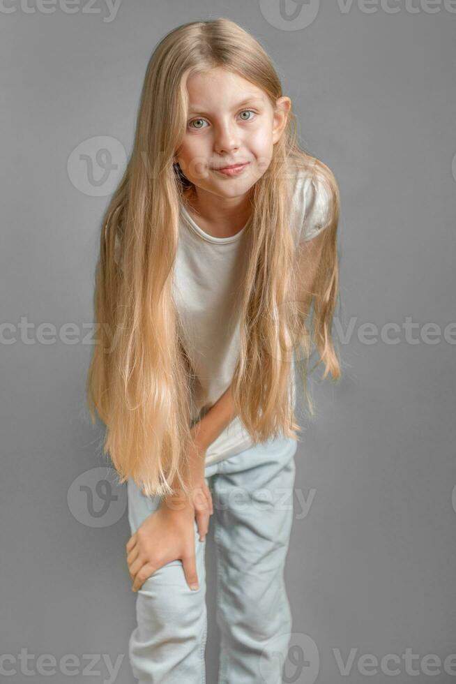 Portrait of cute little girl with long light hair photo