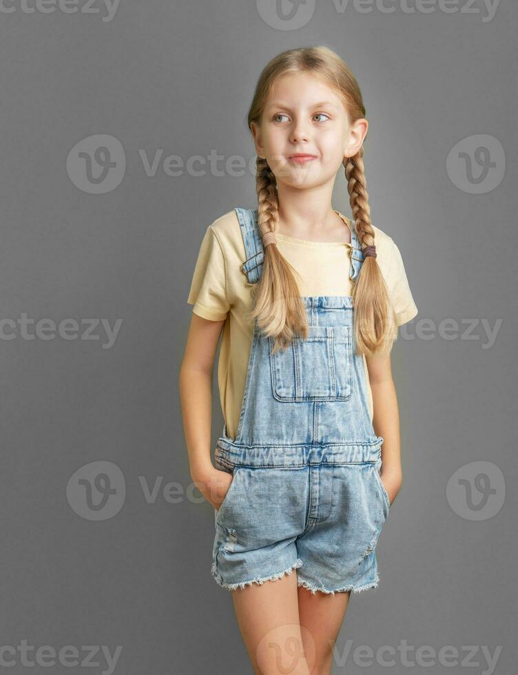 Portrait of a smiling little girl with blond  hair photo