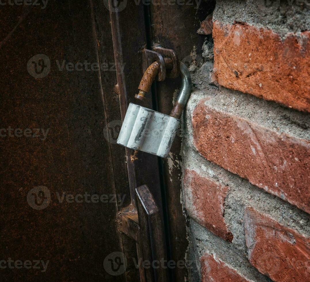 Old rustic gate lock closeup photo