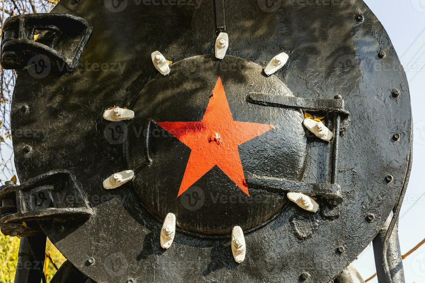 Red metal star on an iron base photo