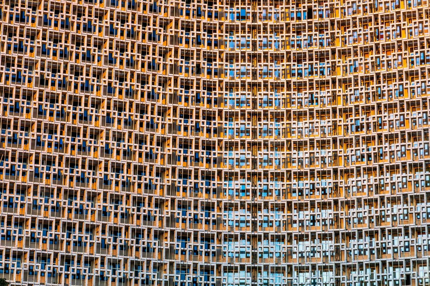 A grid of windows of a skyscraper building in the form of an abstract pattern with an interesting design. photo