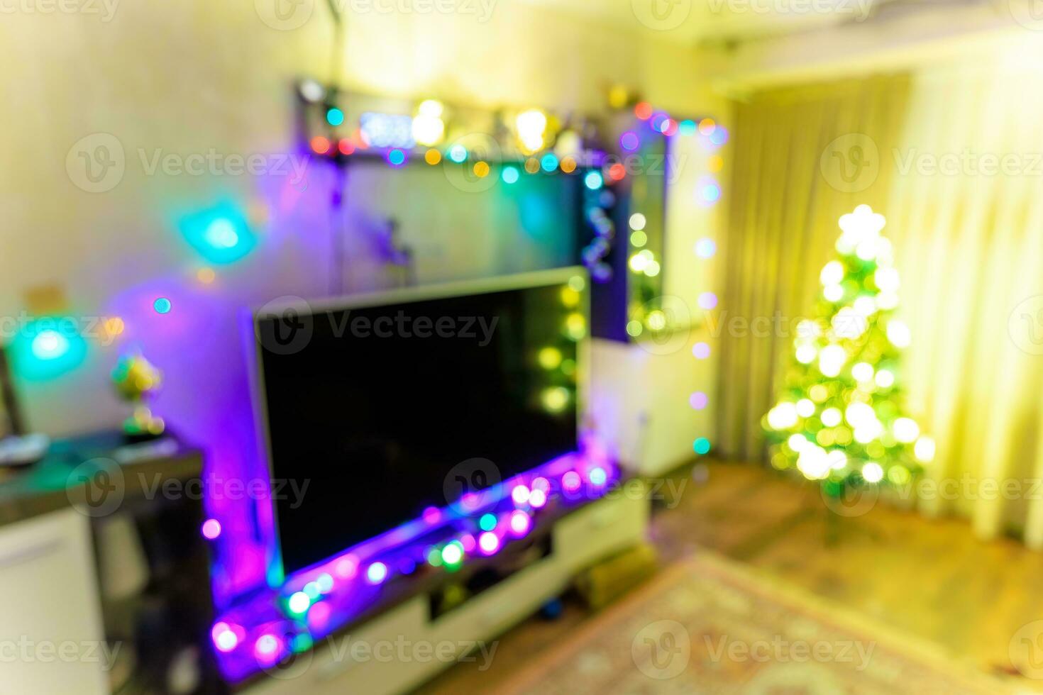 Blurred Christmas and New Year theme background with glowing and sparkling elements photo