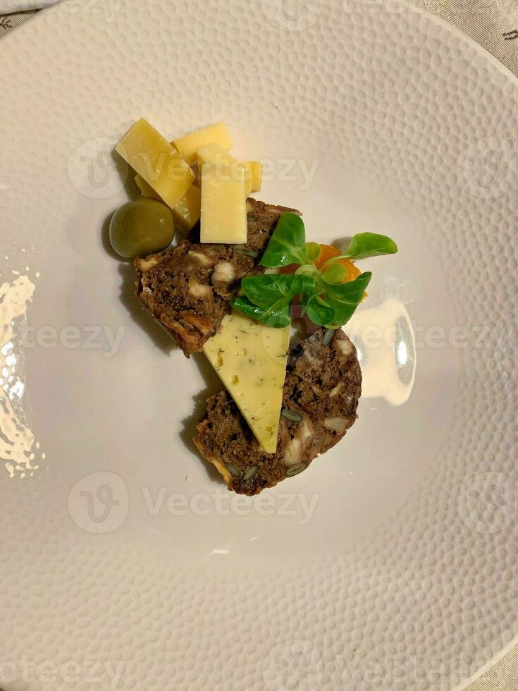 Desert platter with various cheeses and fruit bread photo