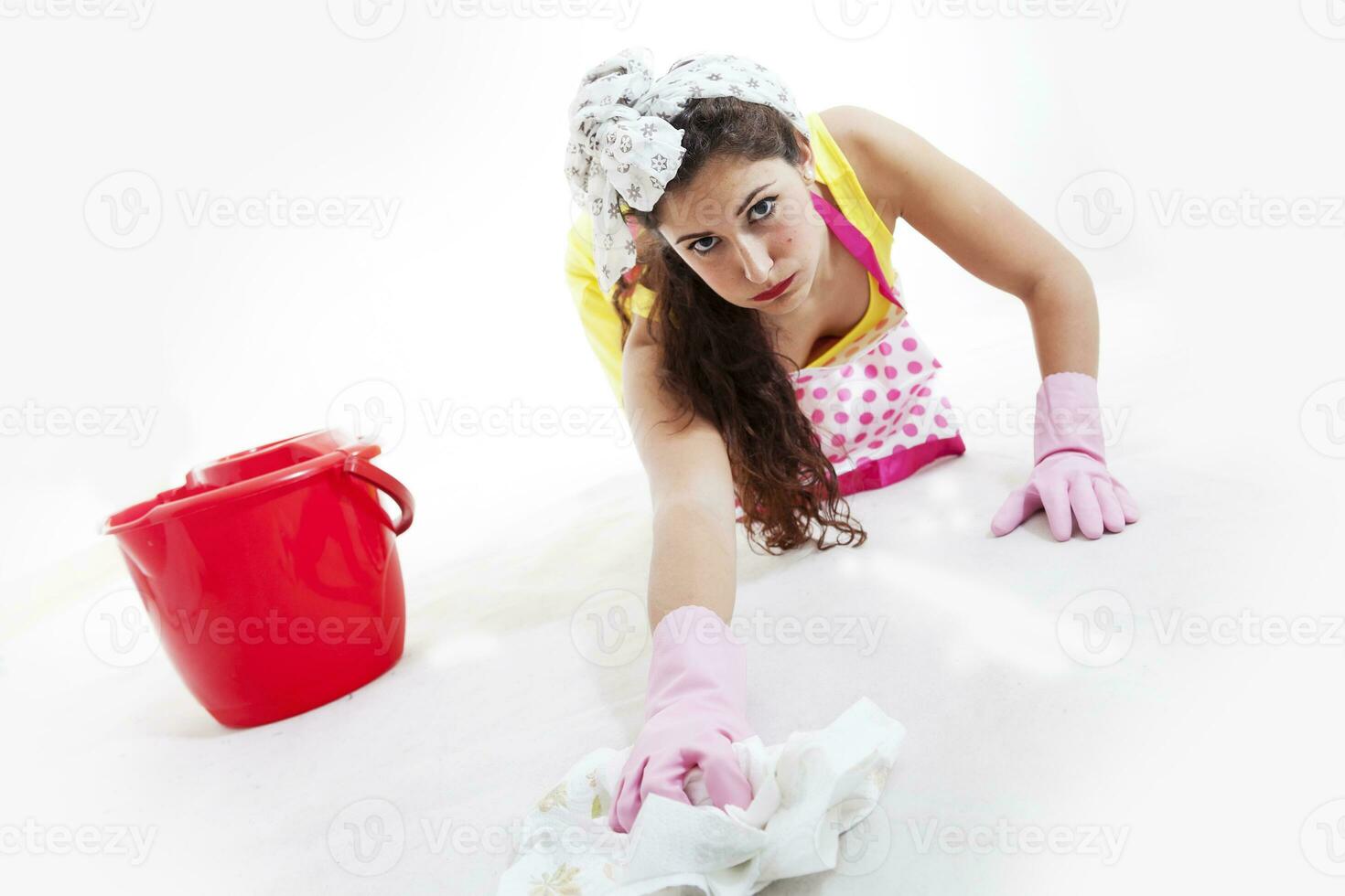 pretty woman with cloth and bucket cleaning the floor photo