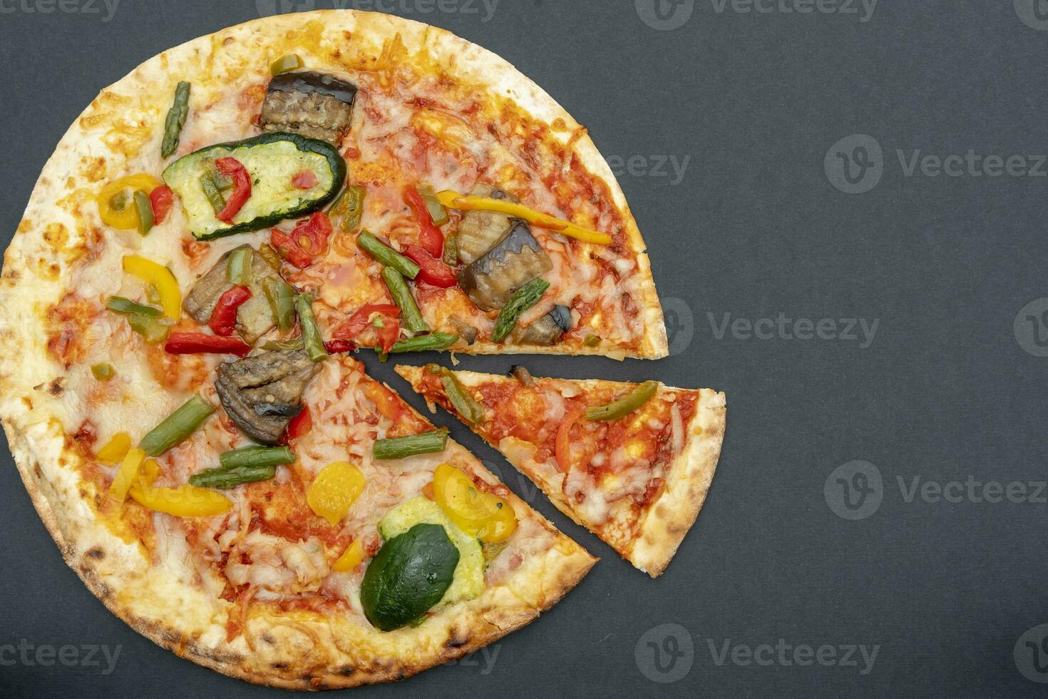 tasty grilled vegetable pizza on black background photo