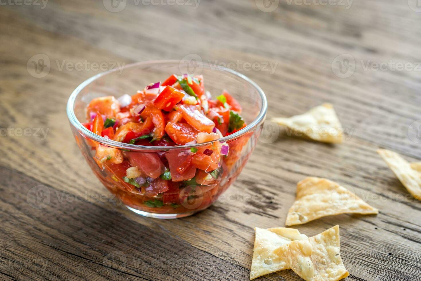 Bowl of salsa with tortilla chips photo