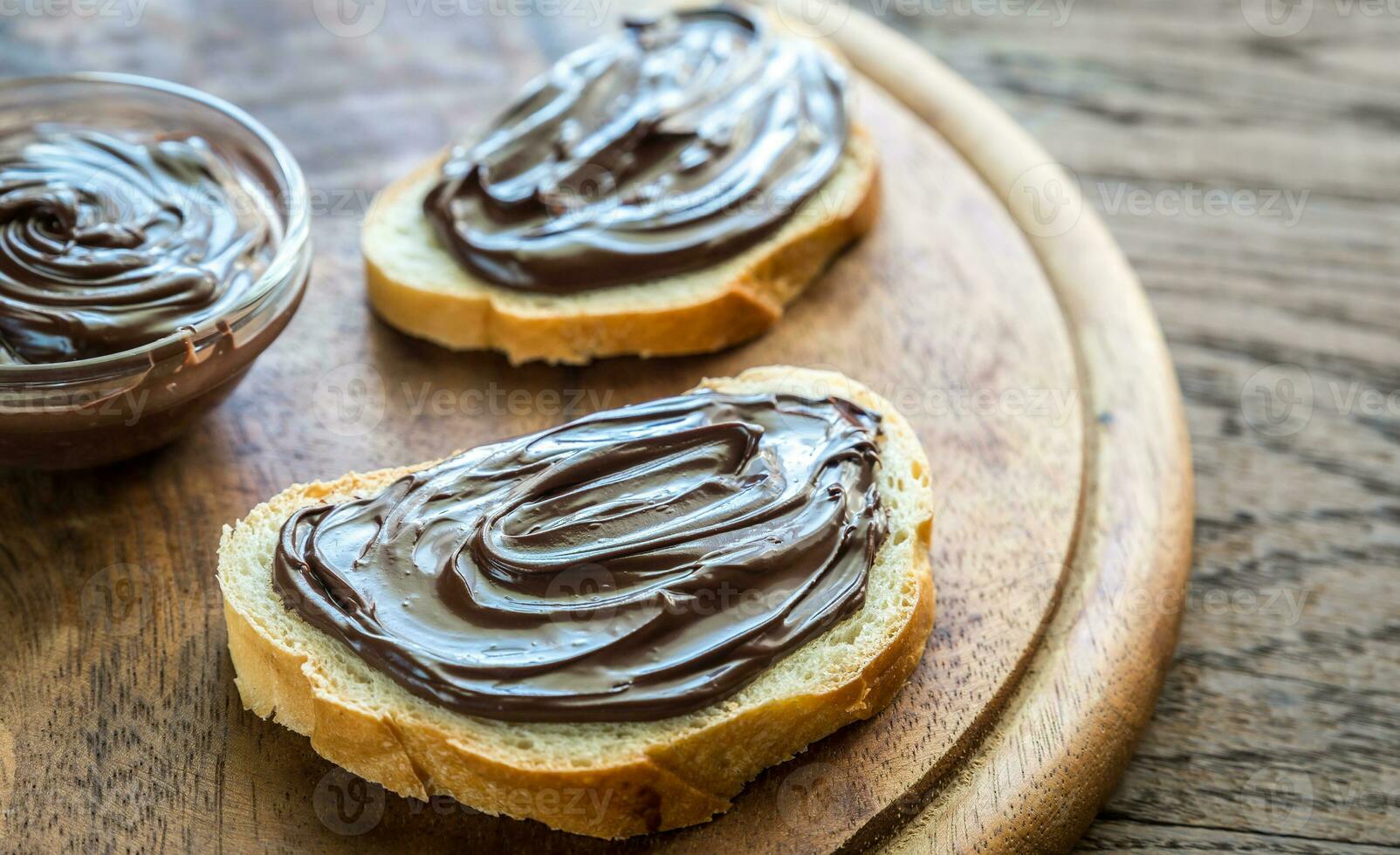 Slices of baguette with chocolate cream photo