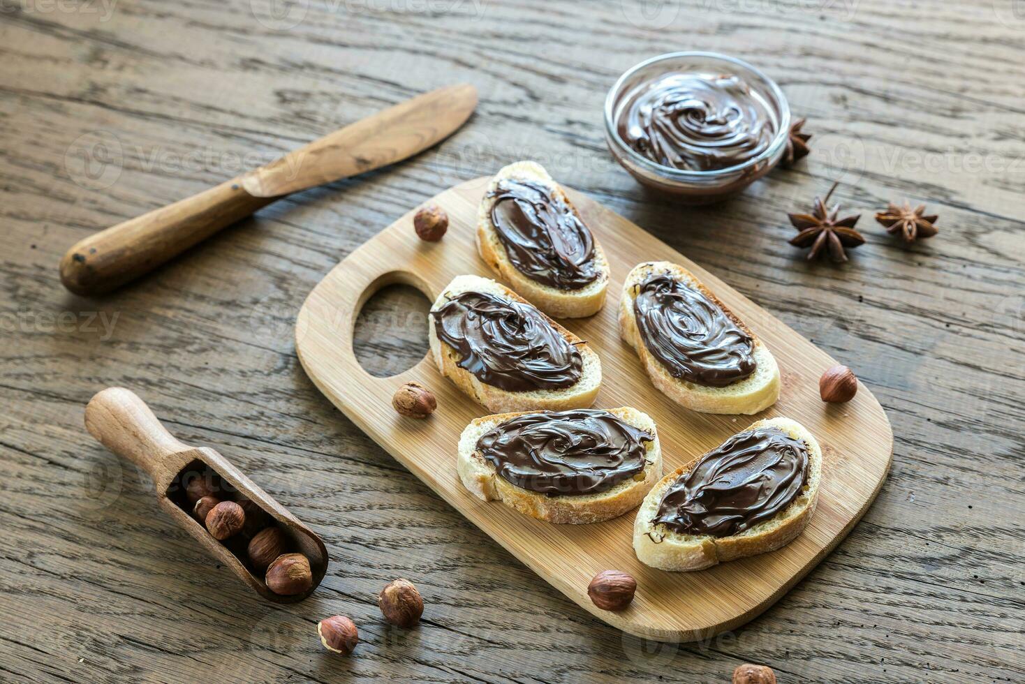 Slices of baguette with chocolate cream photo