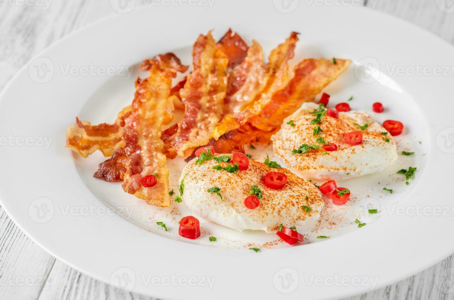 Poached eggs with bacon photo