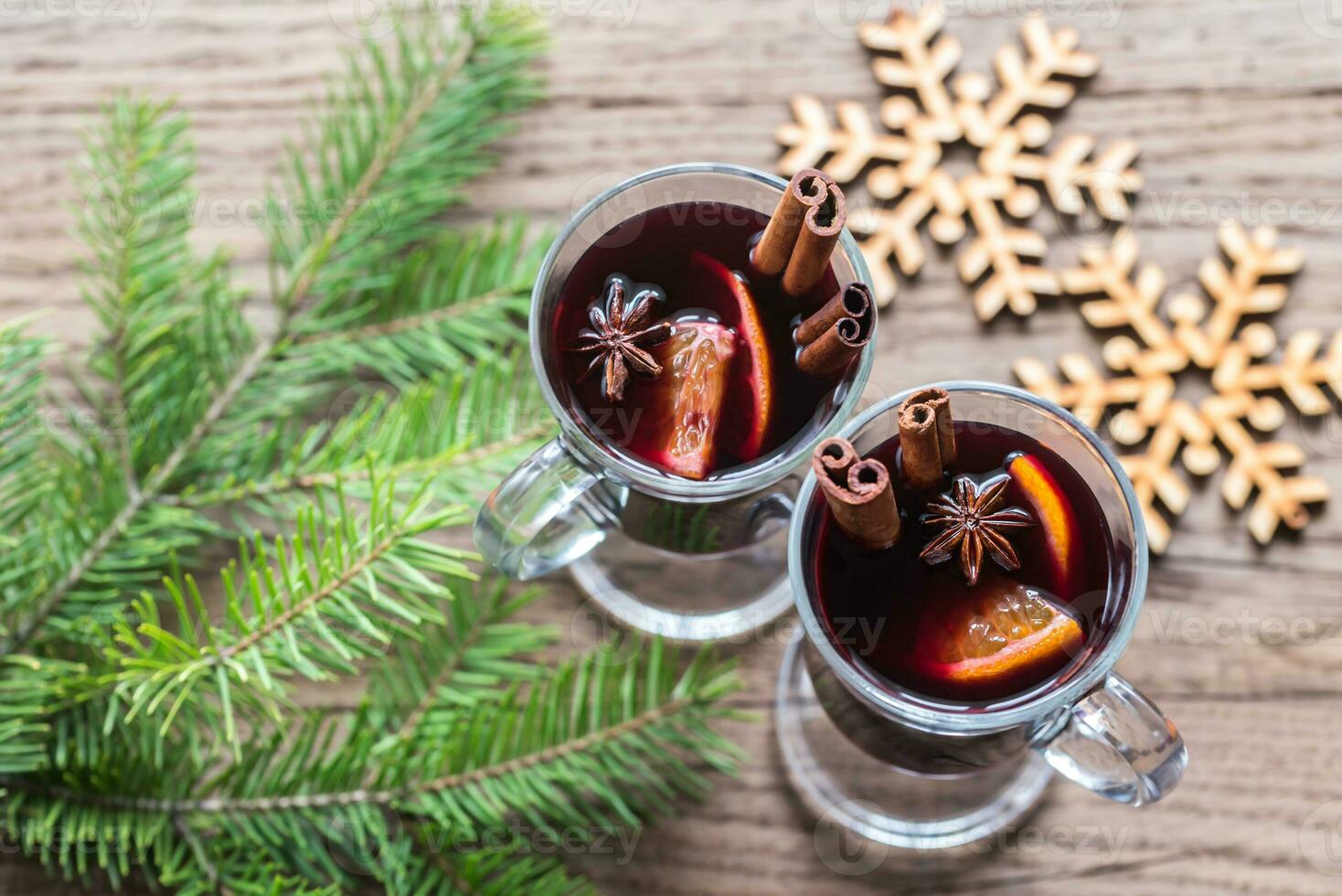 Two glasses of mulled wine with fir branch photo