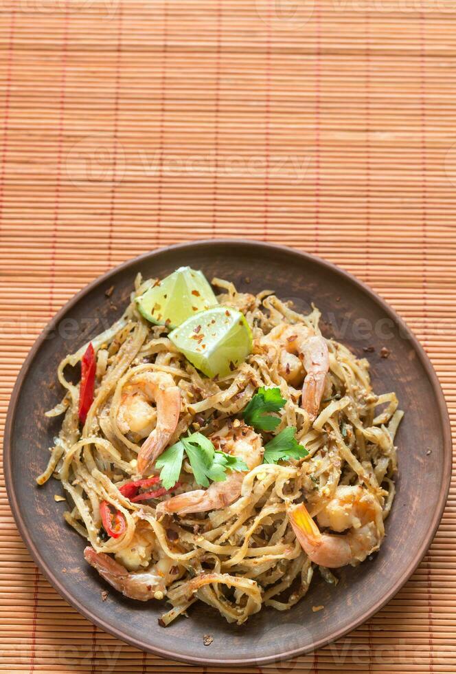 Thai fried rice noodles with shrimps photo