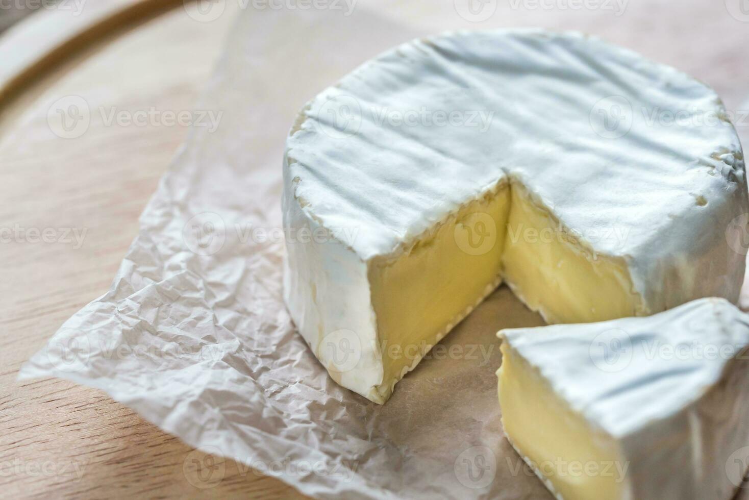 Camembert cheese on the wooden board photo
