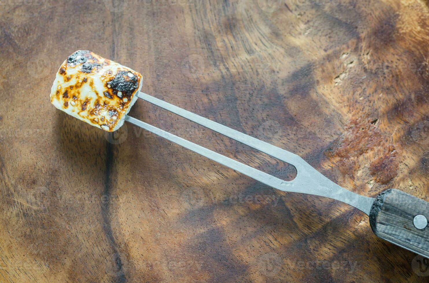 Marshmallow on the wooden background photo