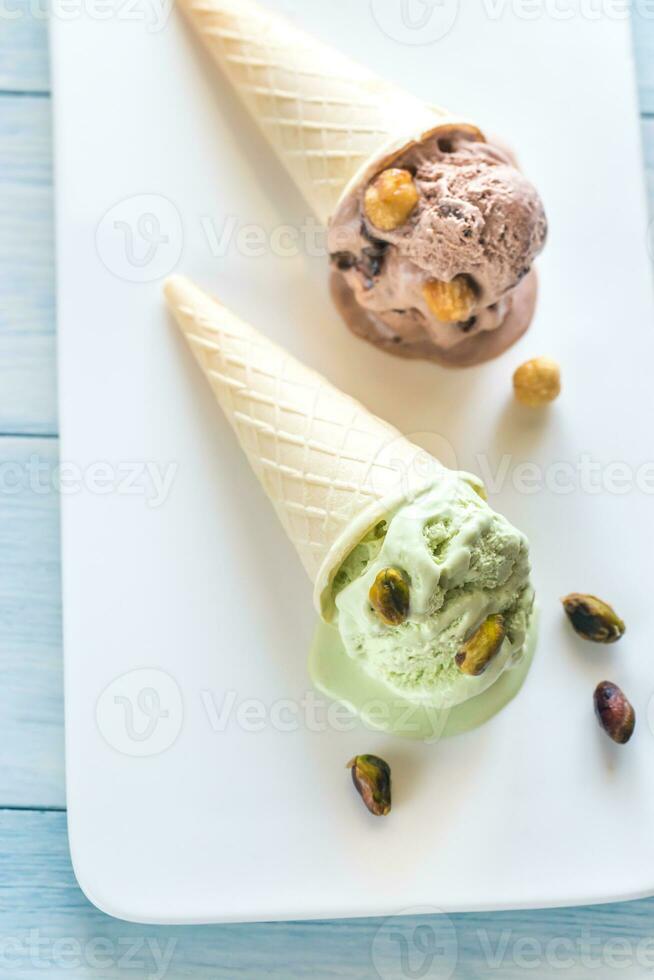 Two cones of nut-flavored ice cream photo