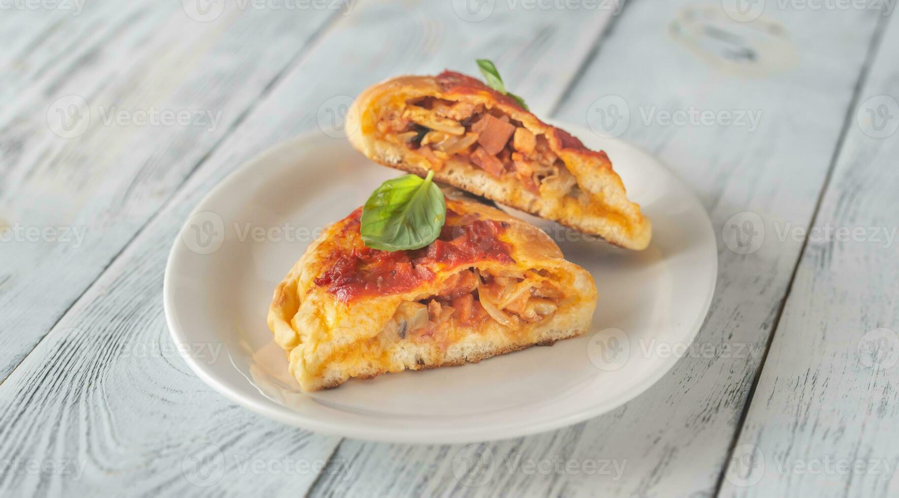 Homemade calzone on the plate photo