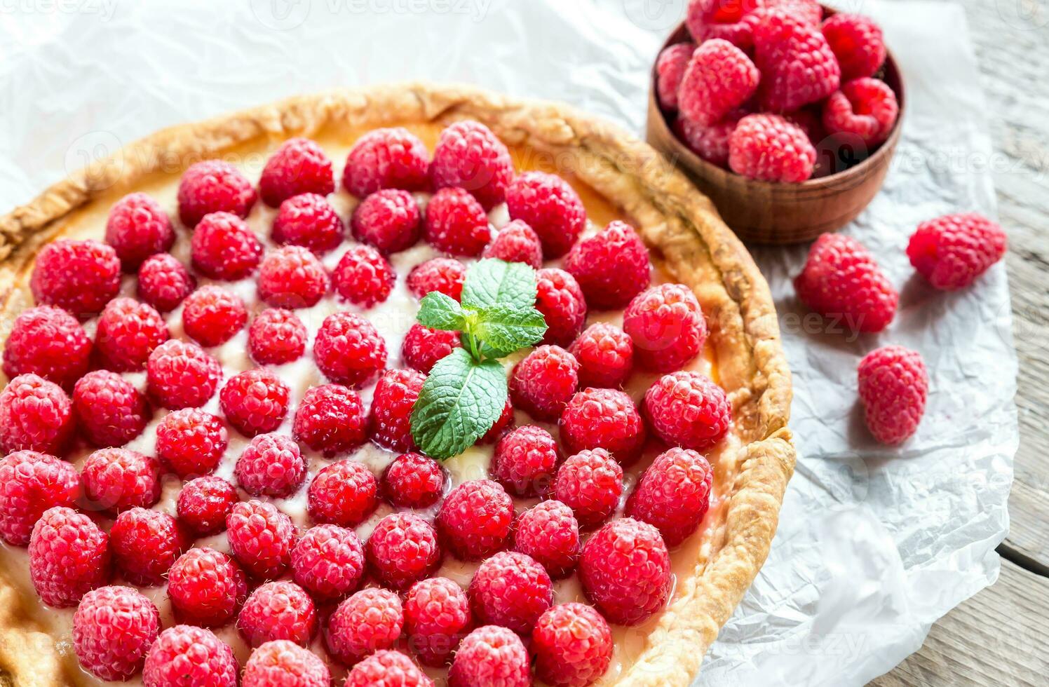 Raspberry tart with custard photo