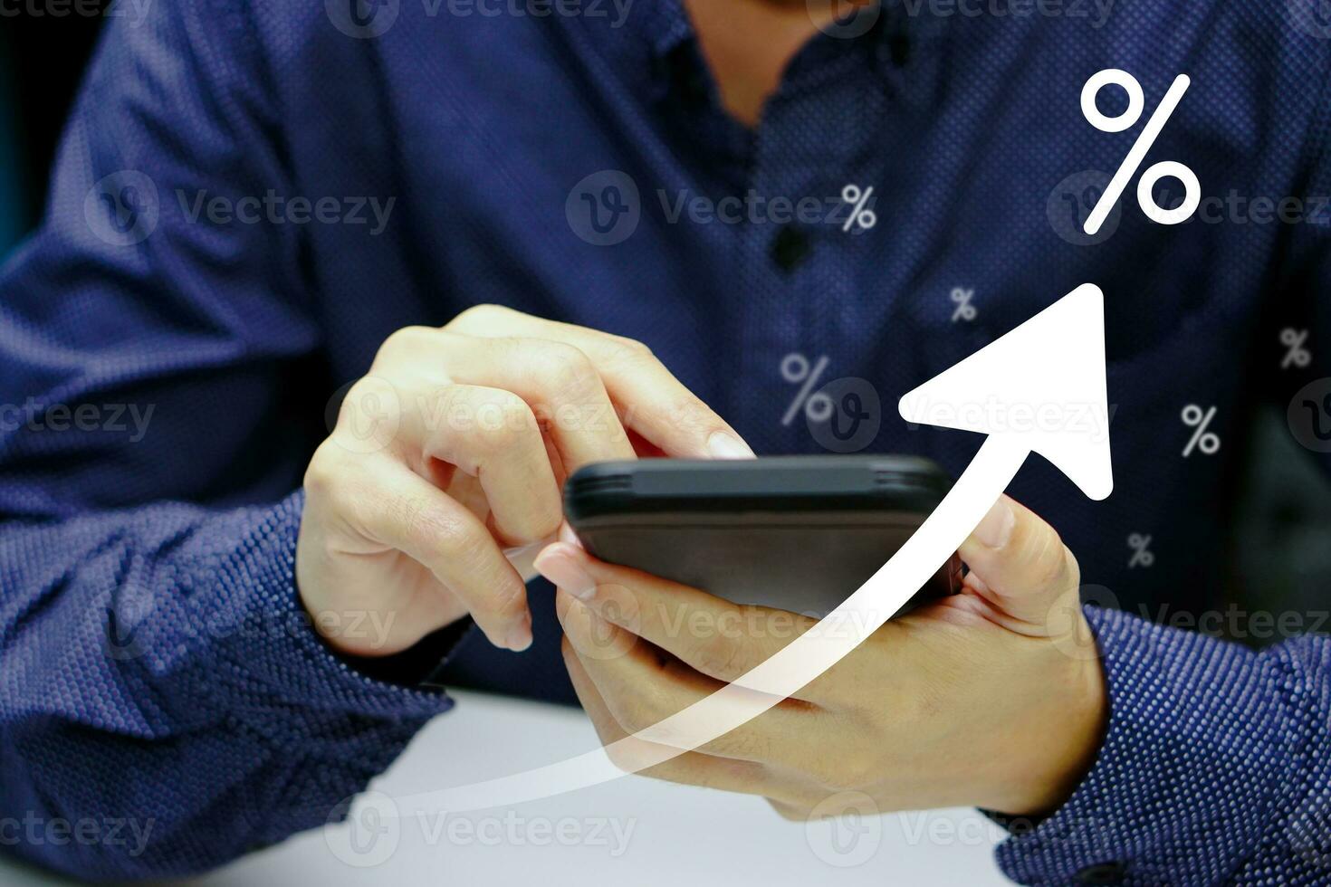 Businessman hand holding mobile showing digital virtual of an arrow pointing up and percentage. Business success, hologram business glowing and future technology. photo
