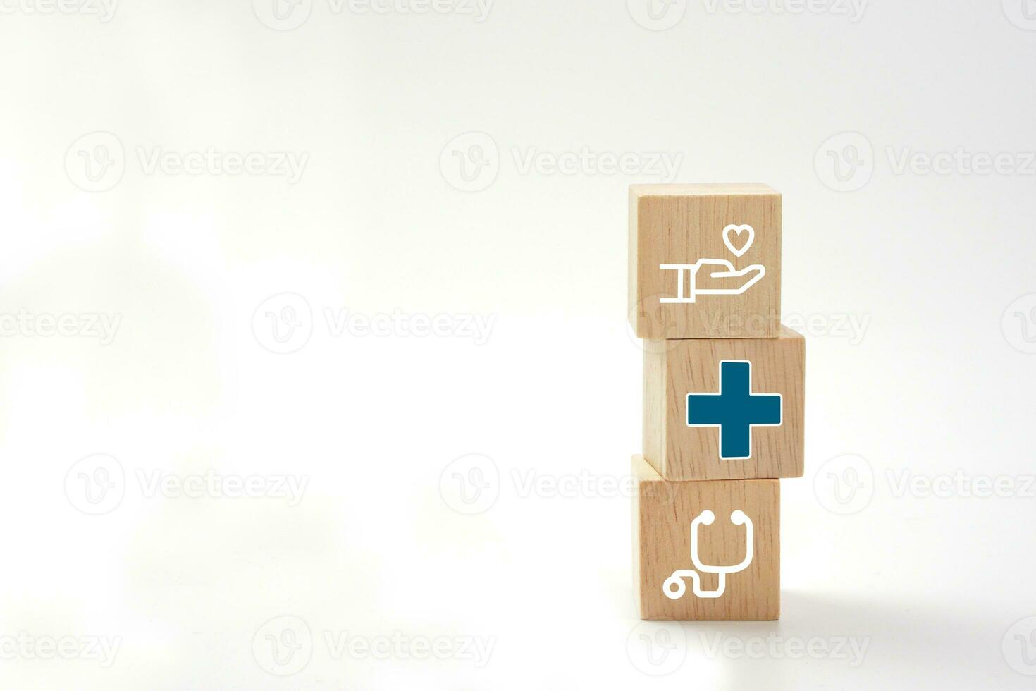 Medical icons on vertical wooden blocks. Health care, health insurance and treatment concept. photo