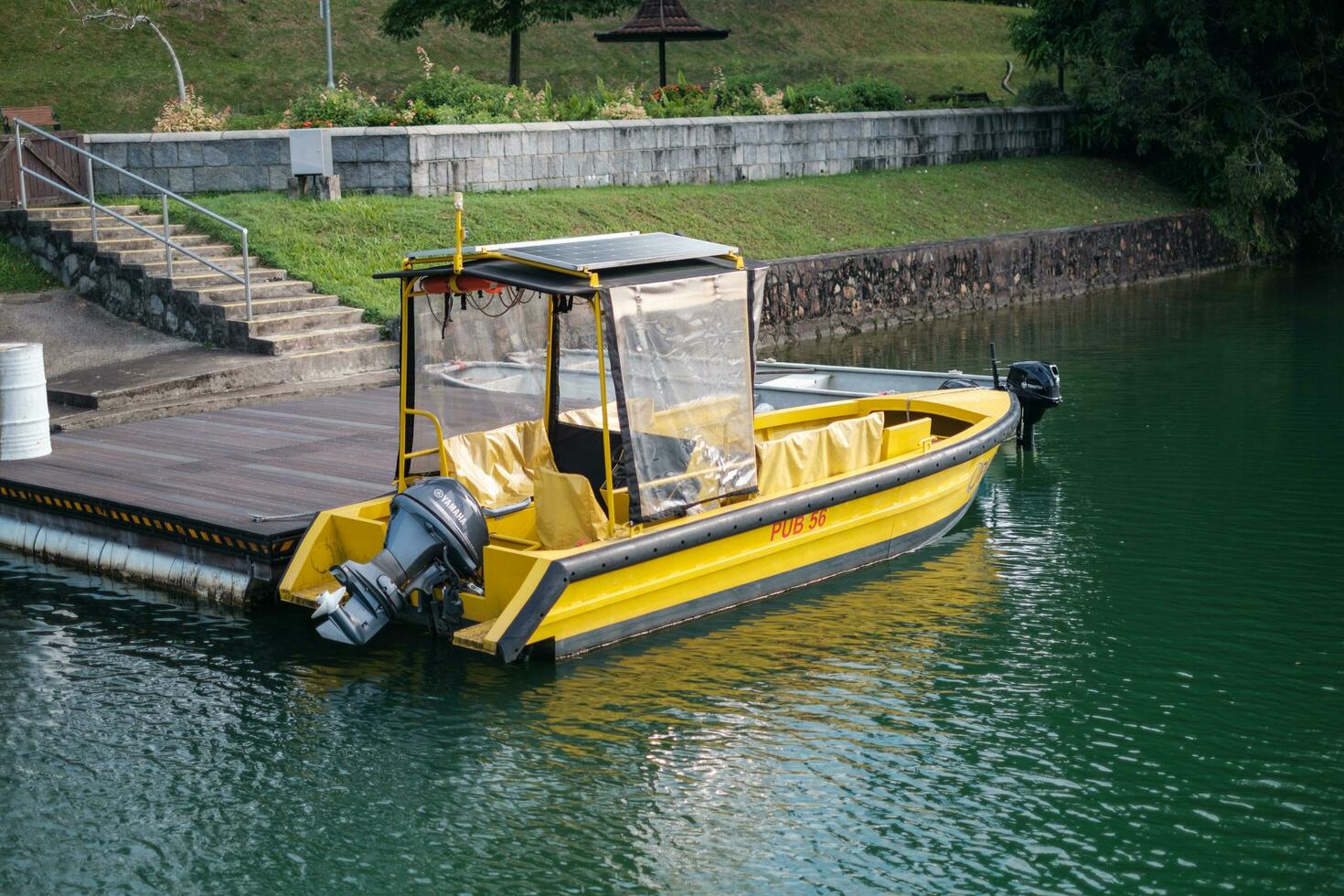 Singapore - September 7 2023 Yellow Patrol Boat at Platform photo