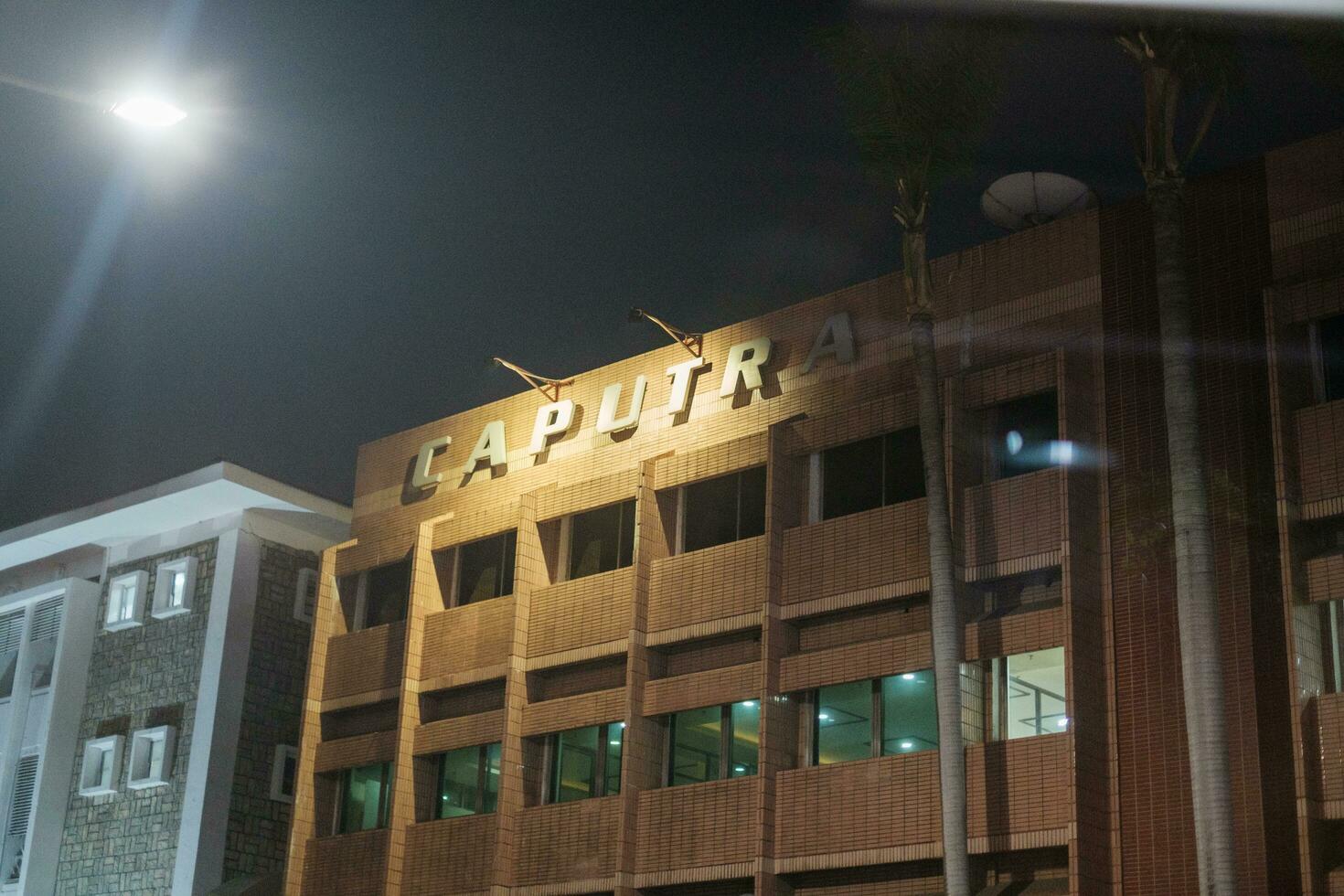 Jakarta, Indonesia - October 4 2023. Nighttime Illuminated Office Building Sign photo