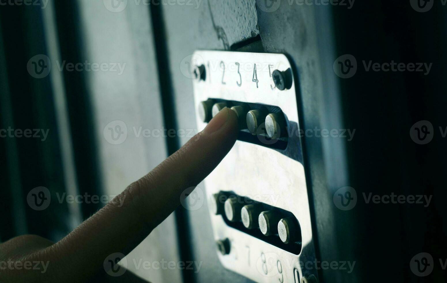 Applying security code on the door photo