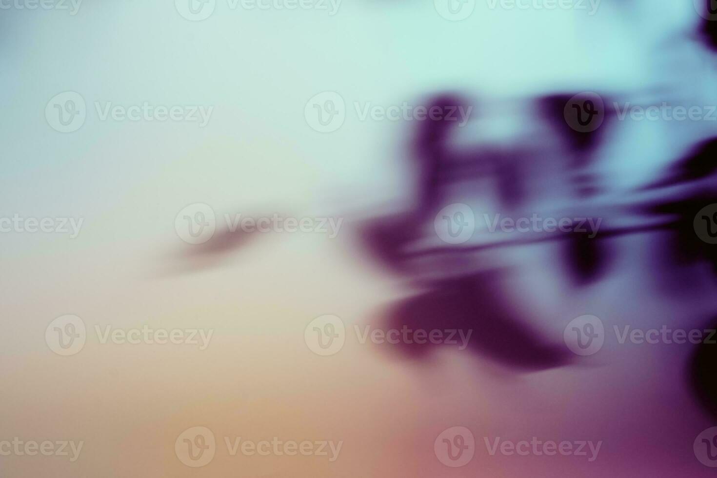 Natural foliage shadow on gradient paper background. Abstract blue and purple floral backdrop. Soft light photo