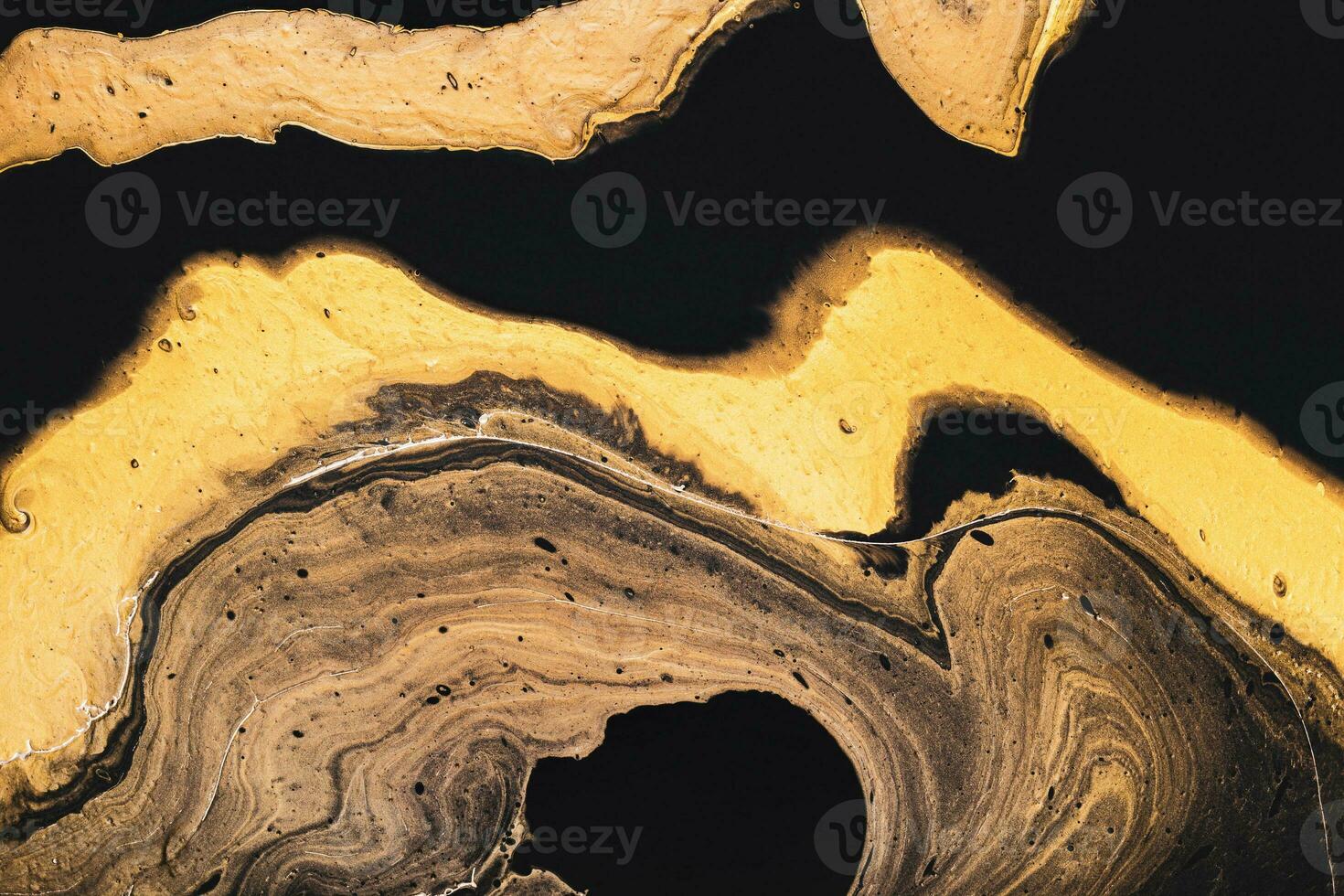 Golden slice of stone on black. Abstract liquid marble background or texture. Acrylic Fluid Art. Digital decor photo