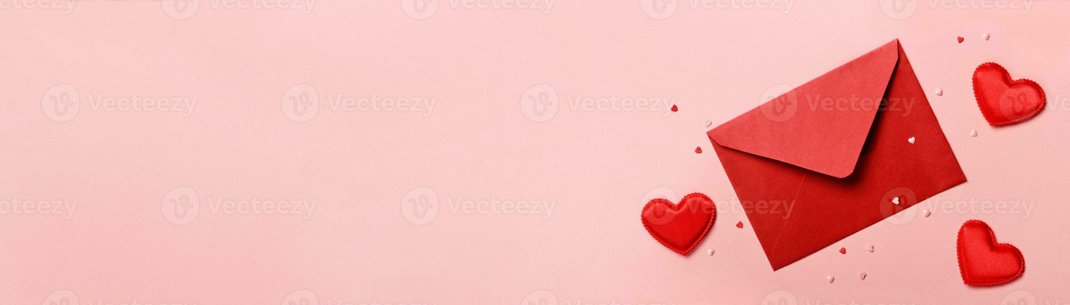 Valentines day banner. Red envelope and hearts on pink background. Romantic concept photo