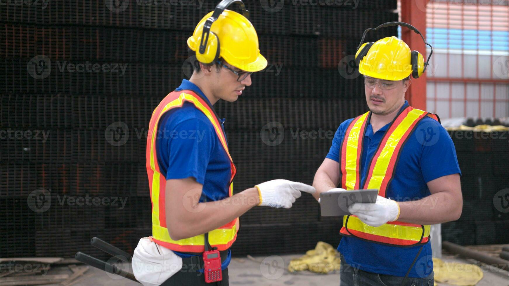 Warehouse workers in hard hats and helmets, Inspect and count steel in the warehouse. photo